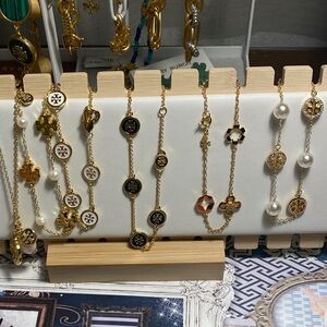 Tory Burch Gold and Black Jewelry Collection